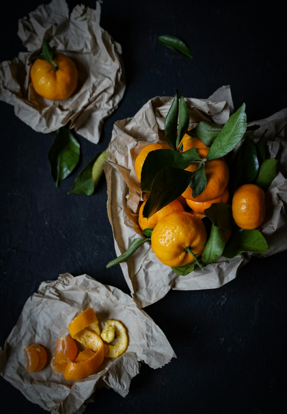 orange fruits on gray textile