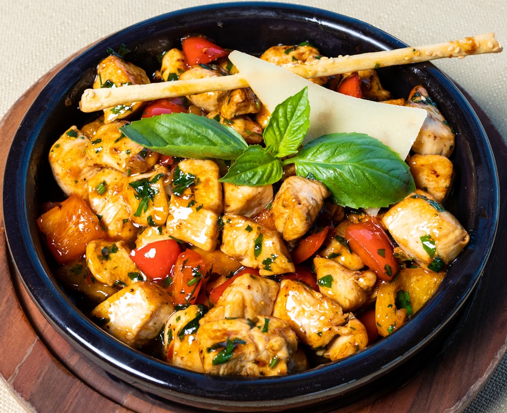 cooked food on black ceramic bowl