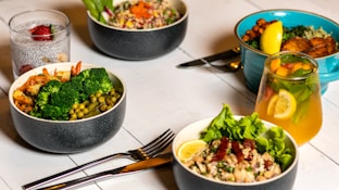 A nutritionist preparing a balanced meal plan with fresh ingredients.