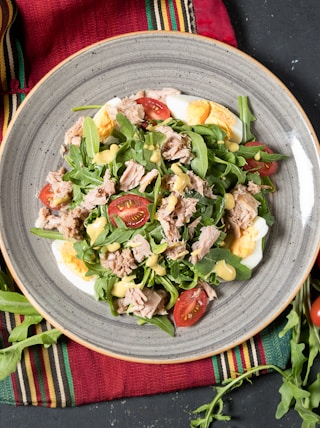 vegetable salad on white ceramic bowl