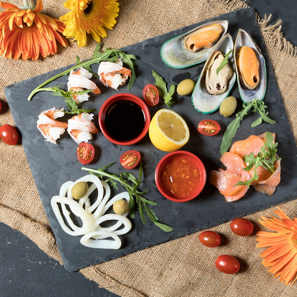 sliced vegetables on black ceramic plate