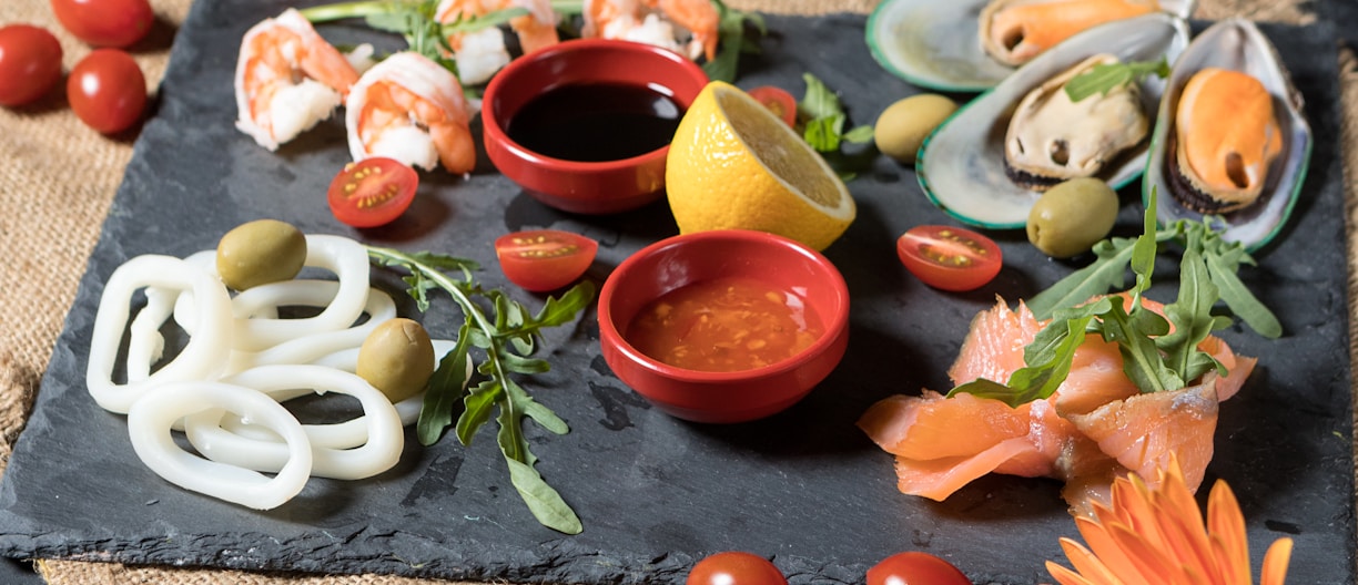 sliced fruits on white ceramic bowl