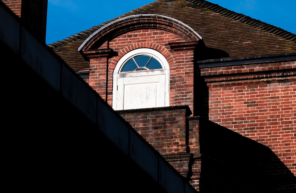 brown brick building under blue sky during daytime