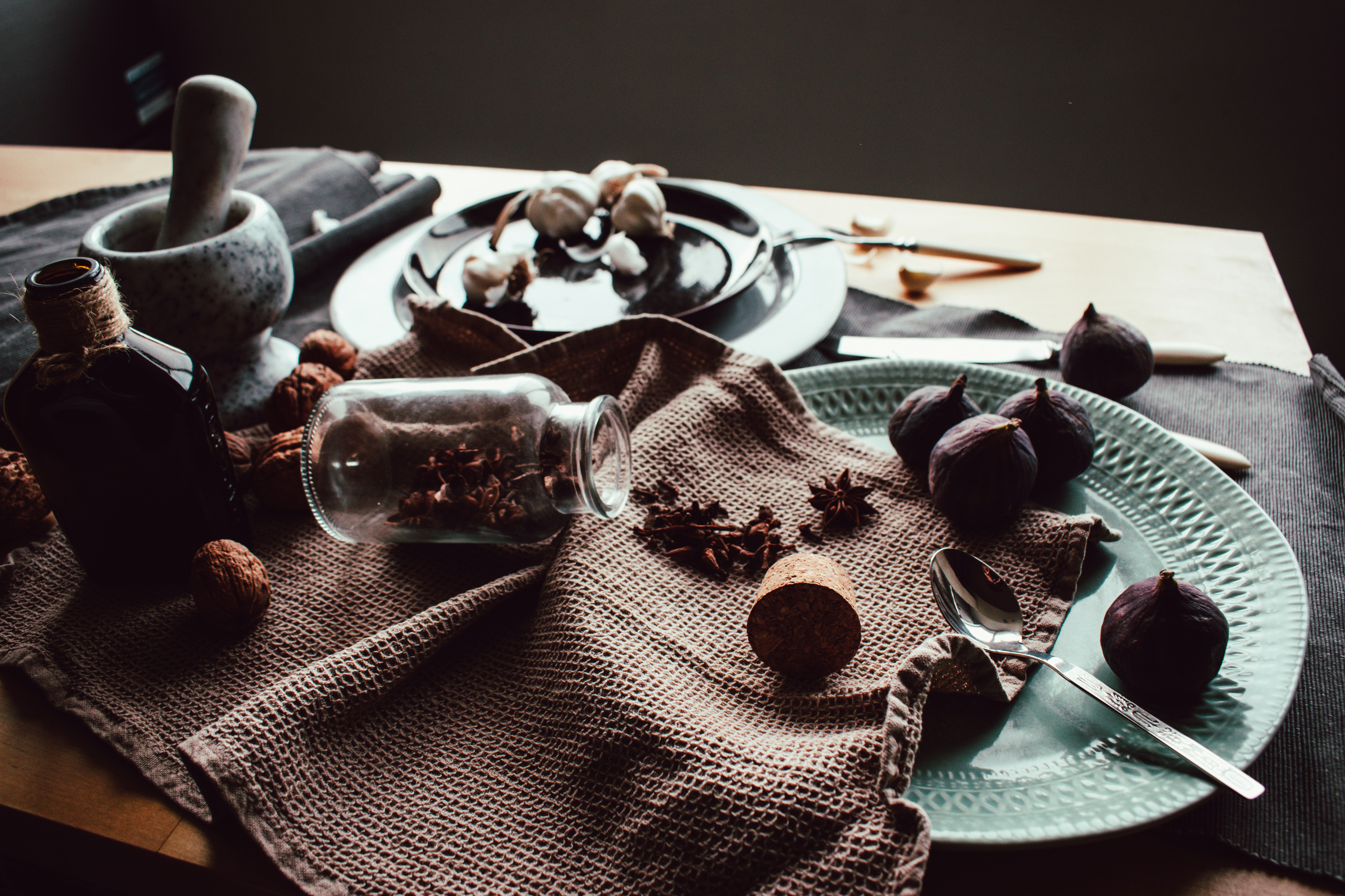 clear drinking glass on white ceramic plate