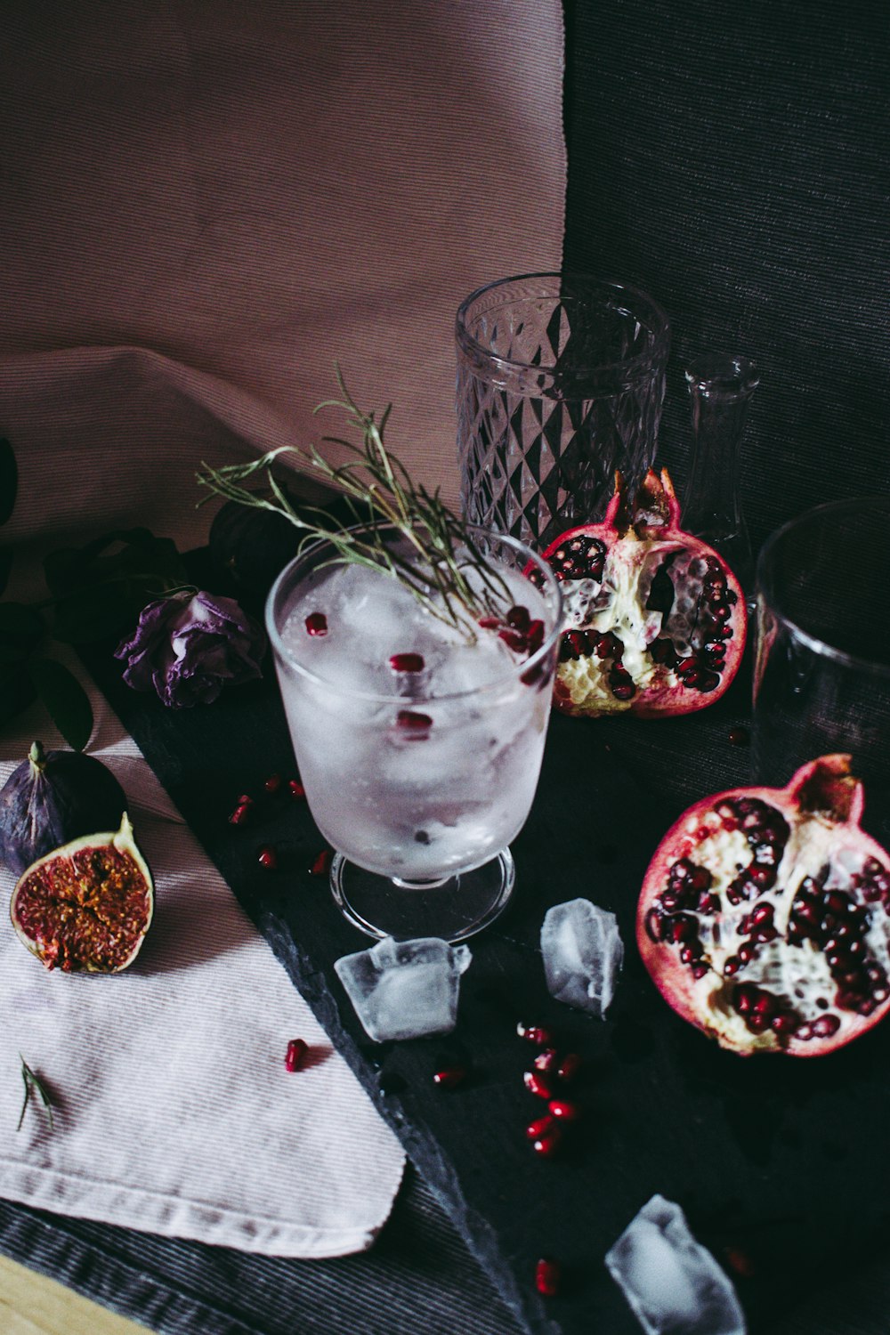 clear drinking glass with ice and strawberry fruits