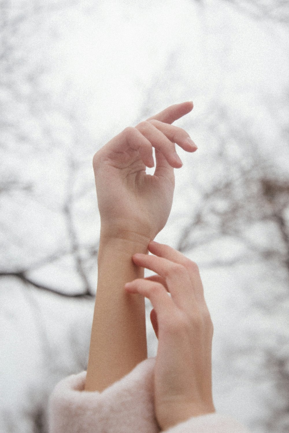 persons left hand doing heart sign