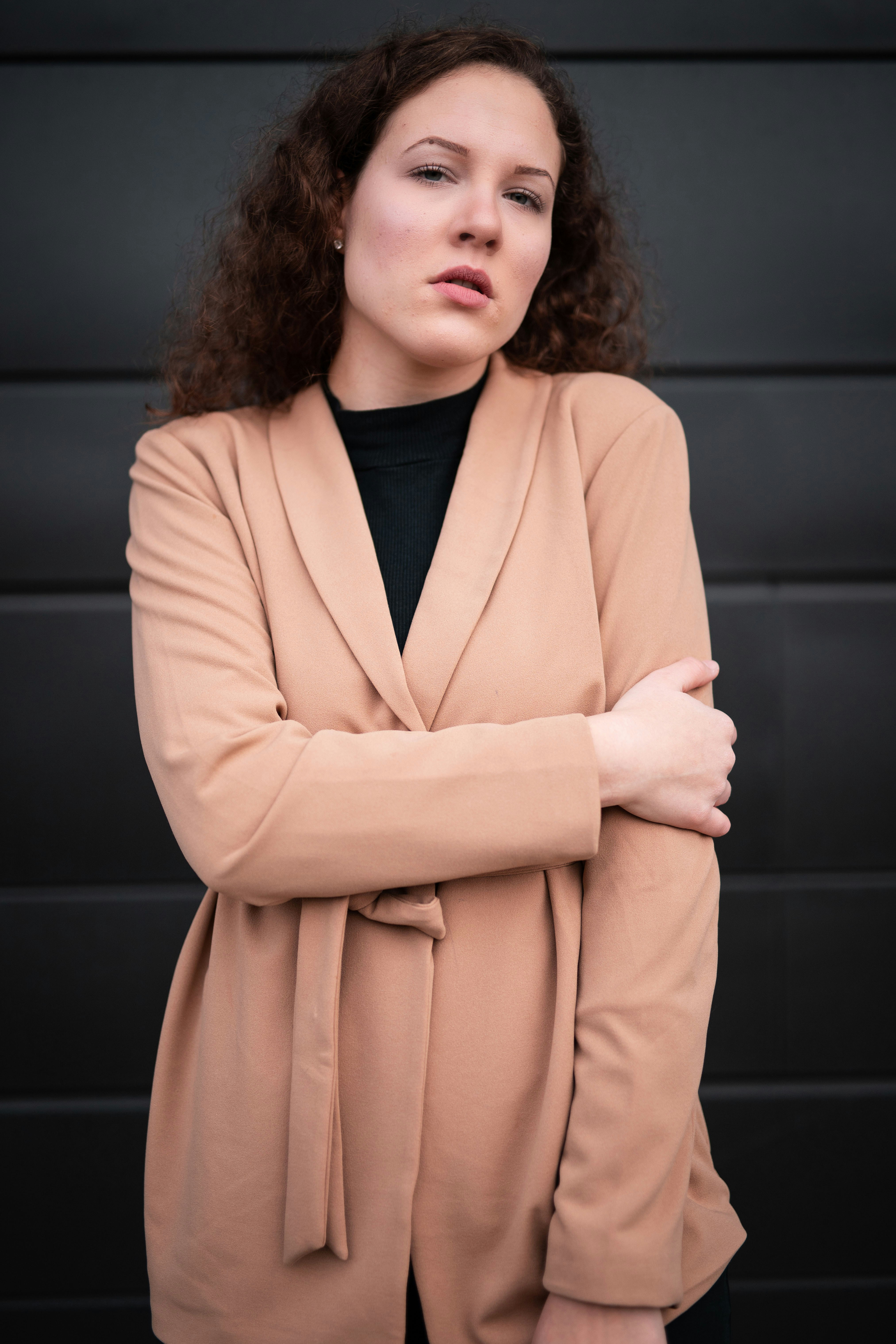 woman-in-beige-coat-standing