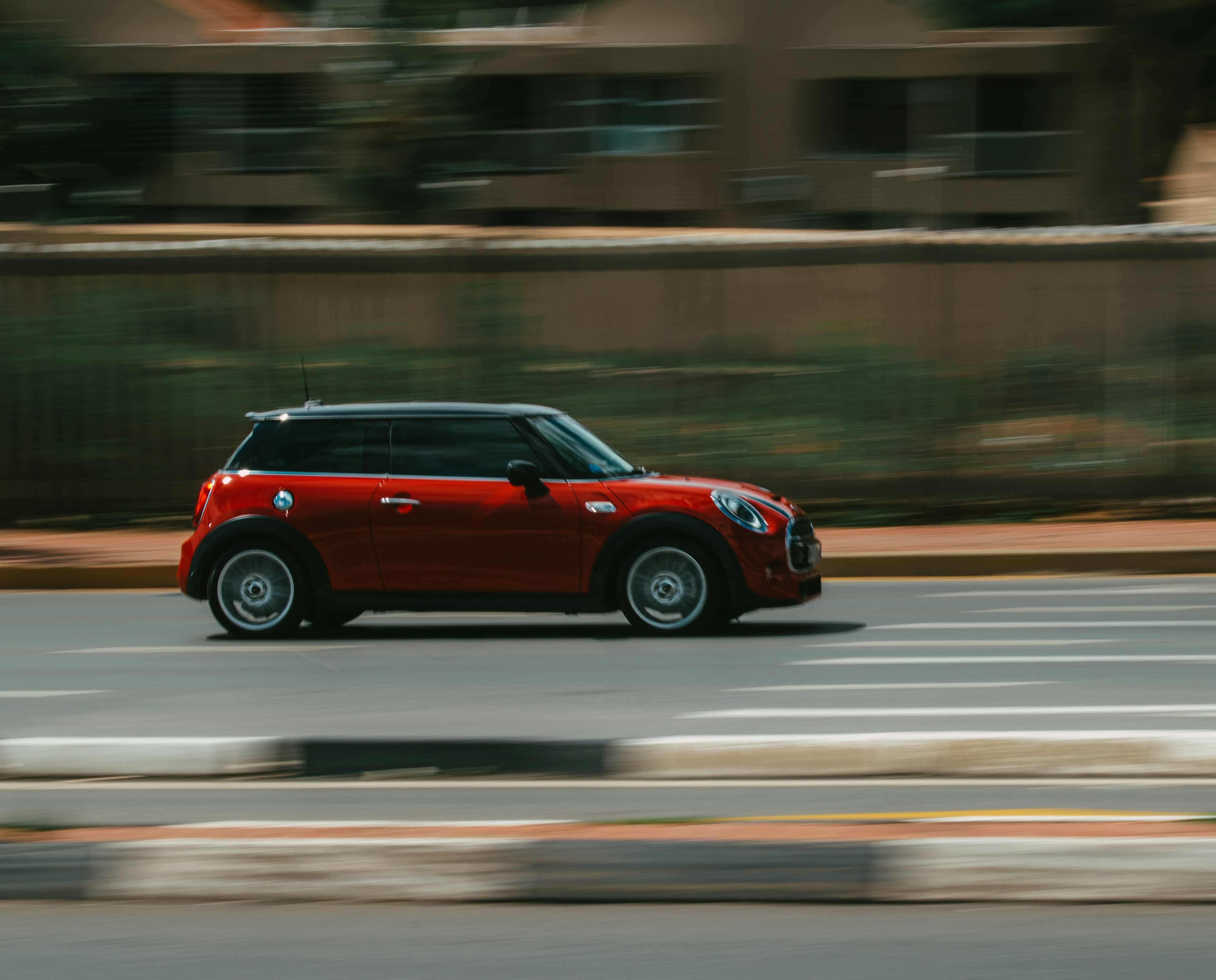 red and black suv on road