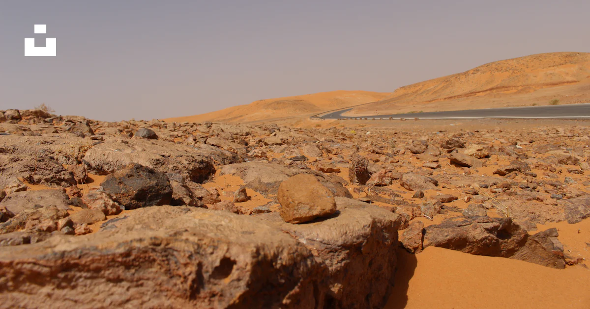 The Brown Rocks Brown rock formation near body of water during daytime photo – Free ...