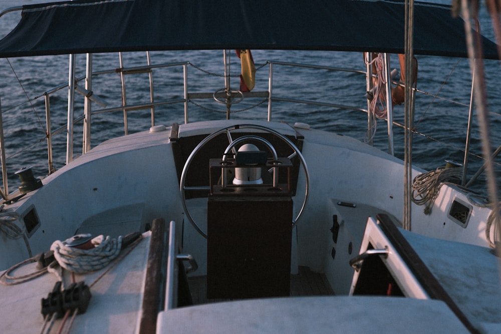 white and black boat on sea during daytime