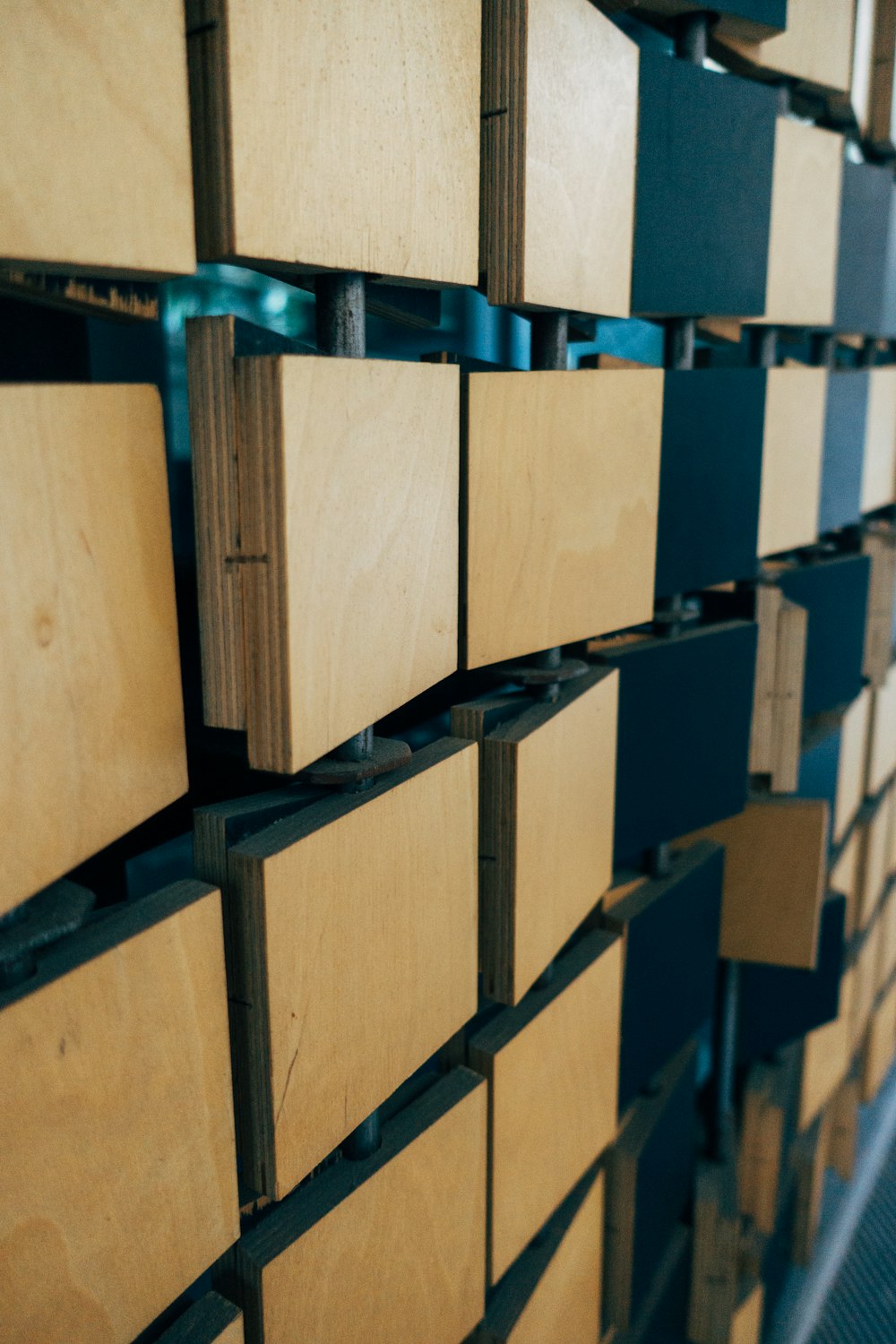 brown cardboard boxes on blue steel rack