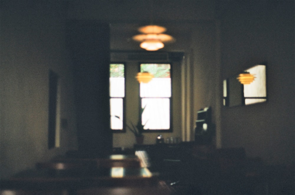 brown wooden table near window