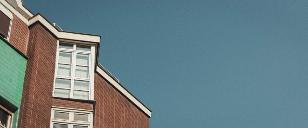 brown brick building under blue sky during daytime