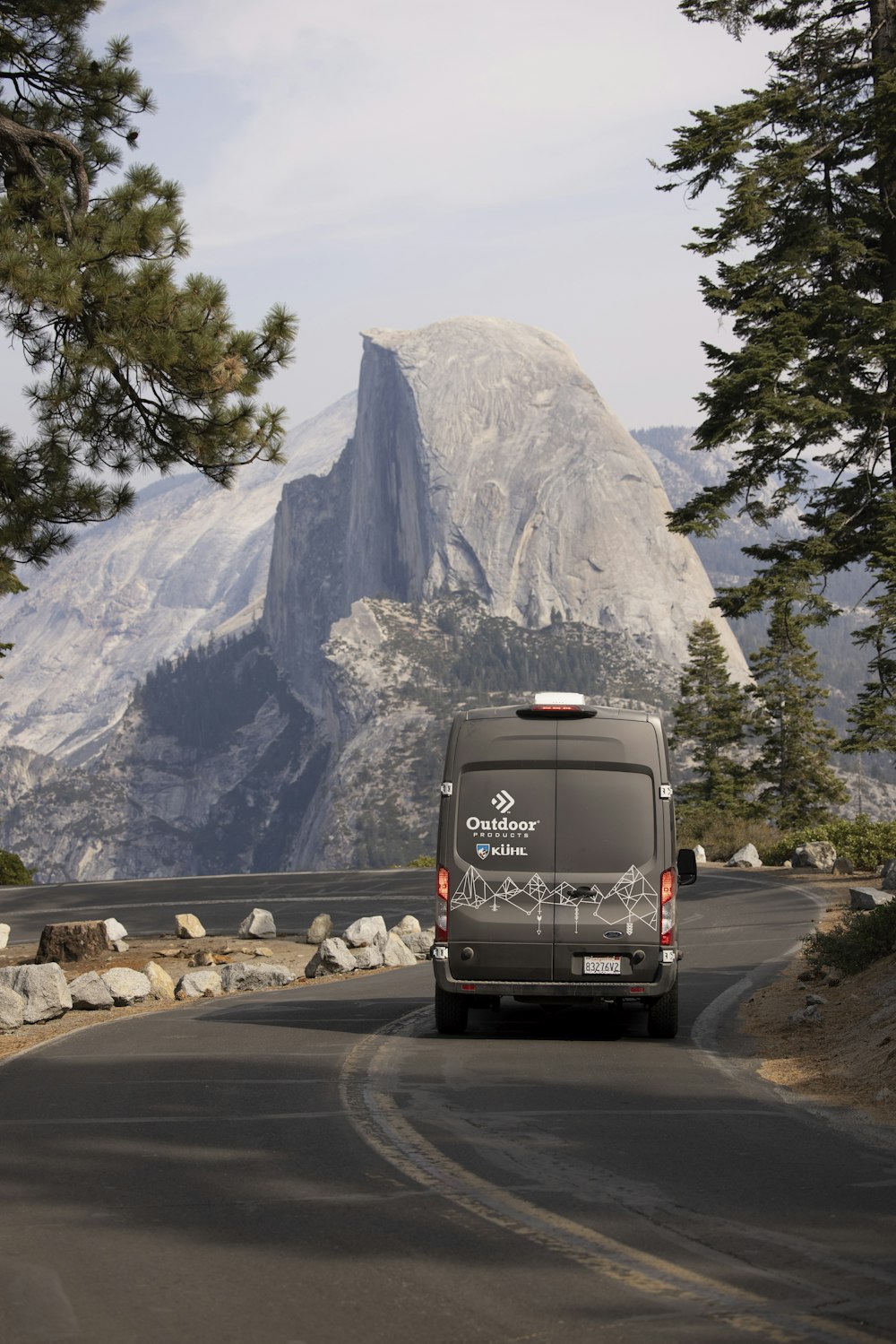 black van on road near mountain during daytime