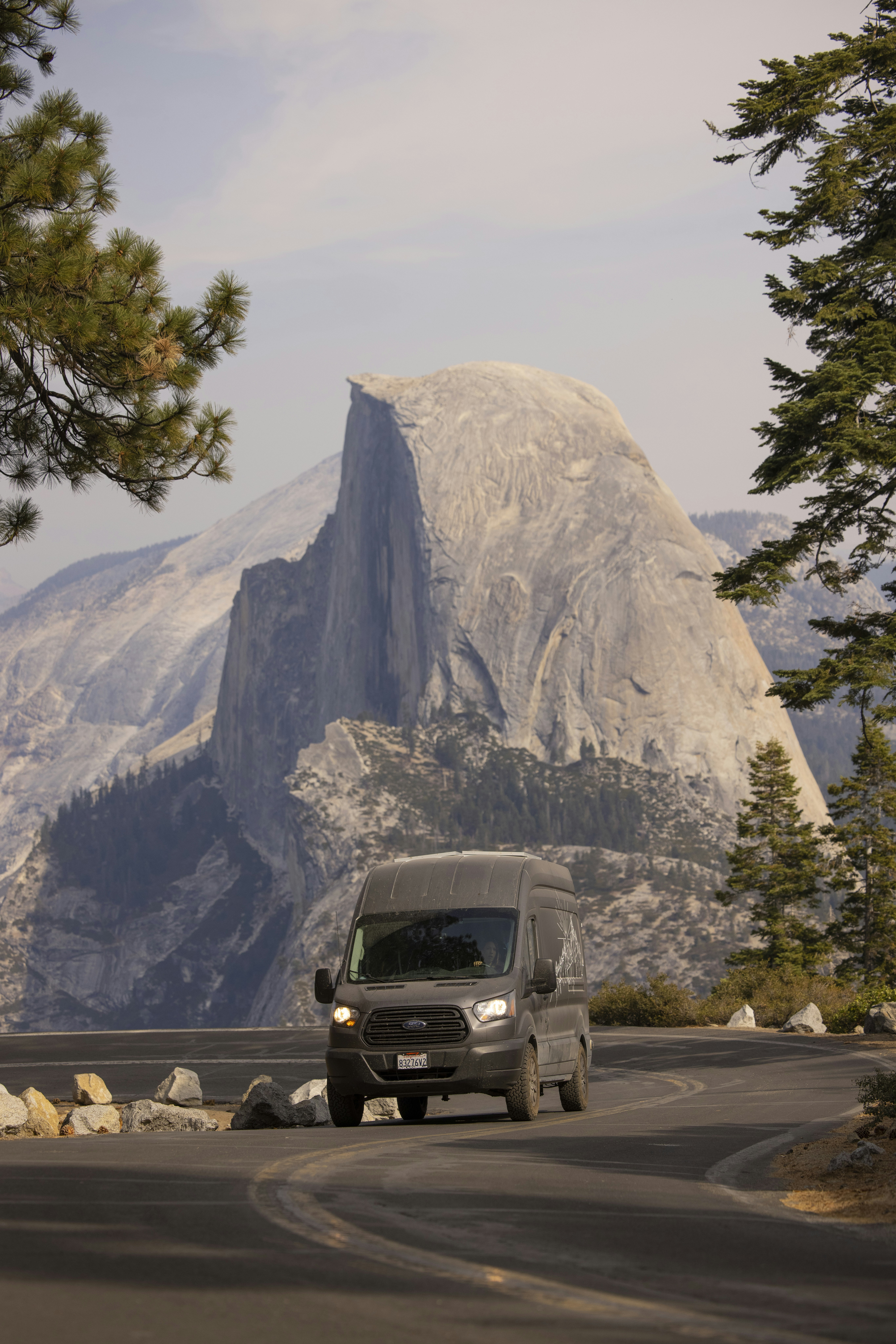 black suv on road near mountain during daytime