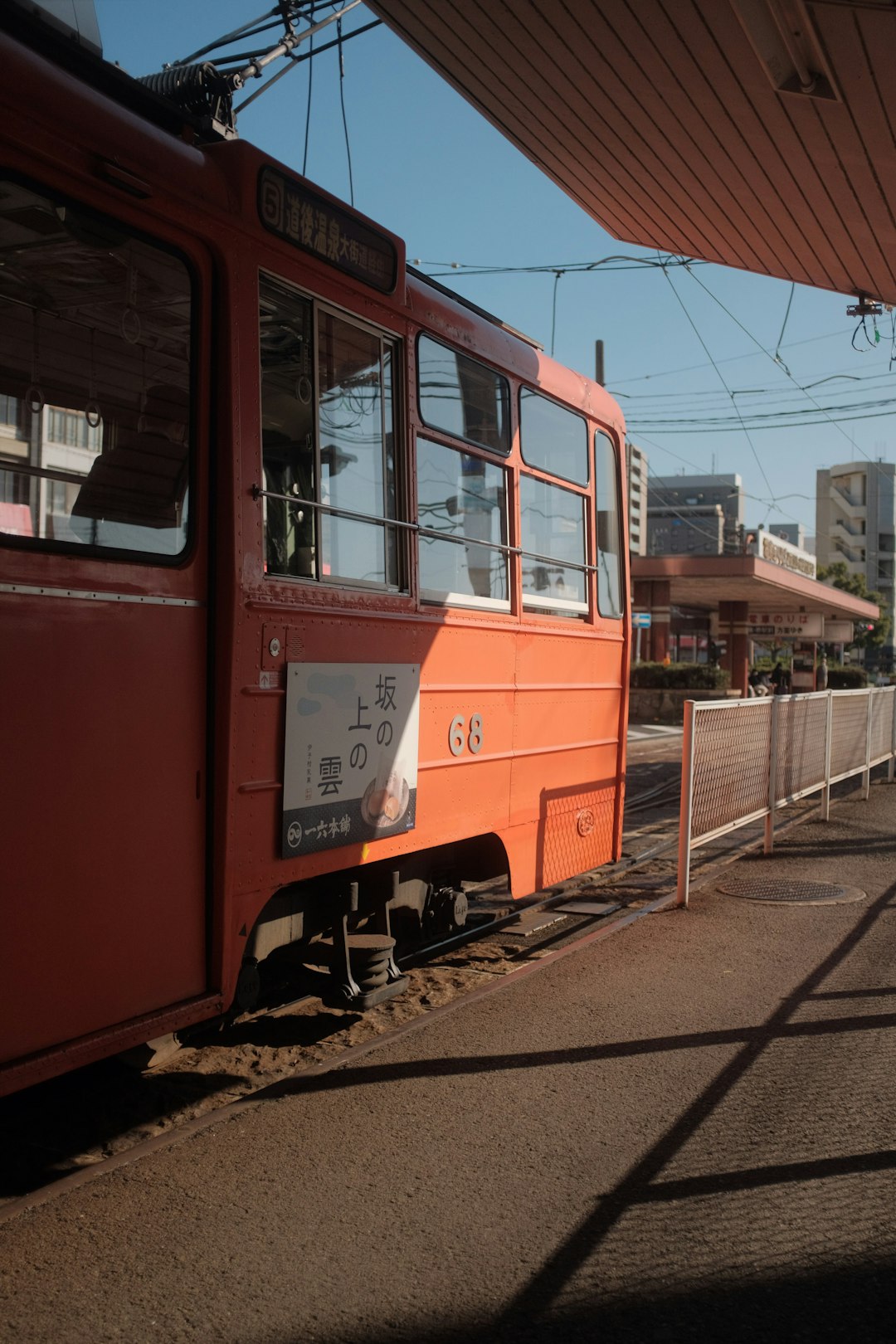 red and white train on rail road during daytime