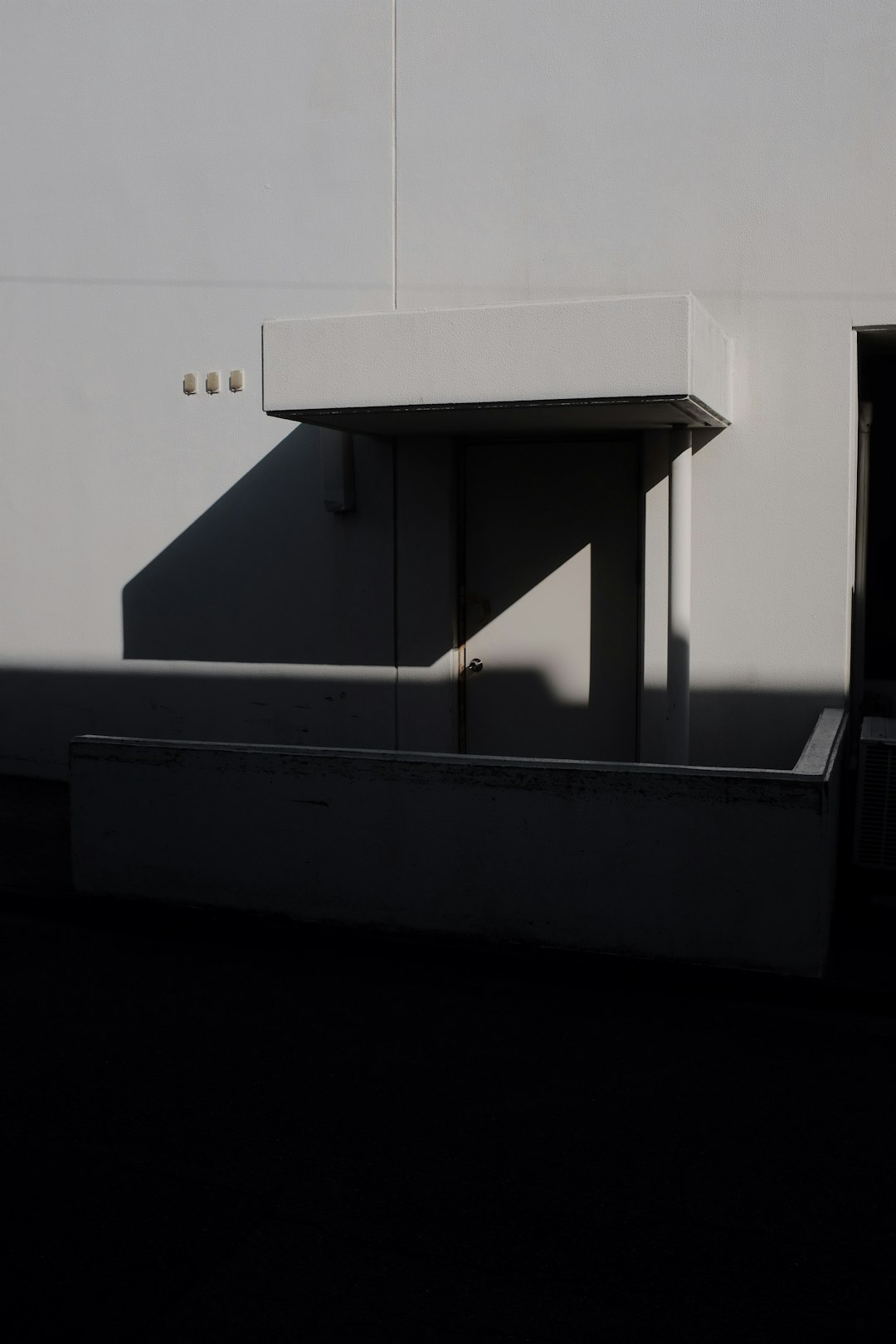 white wooden stairs with white wall