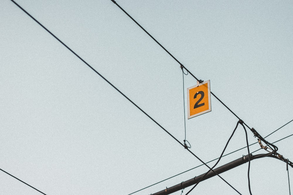 yellow and black street sign