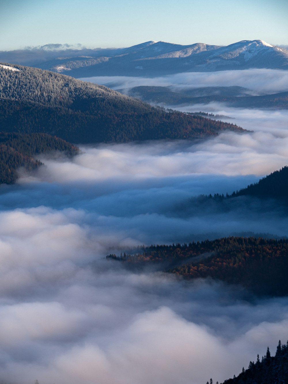 aerial view of mountains covered with clouds