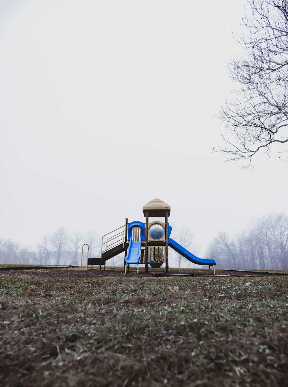 blue and brown wooden playground slide