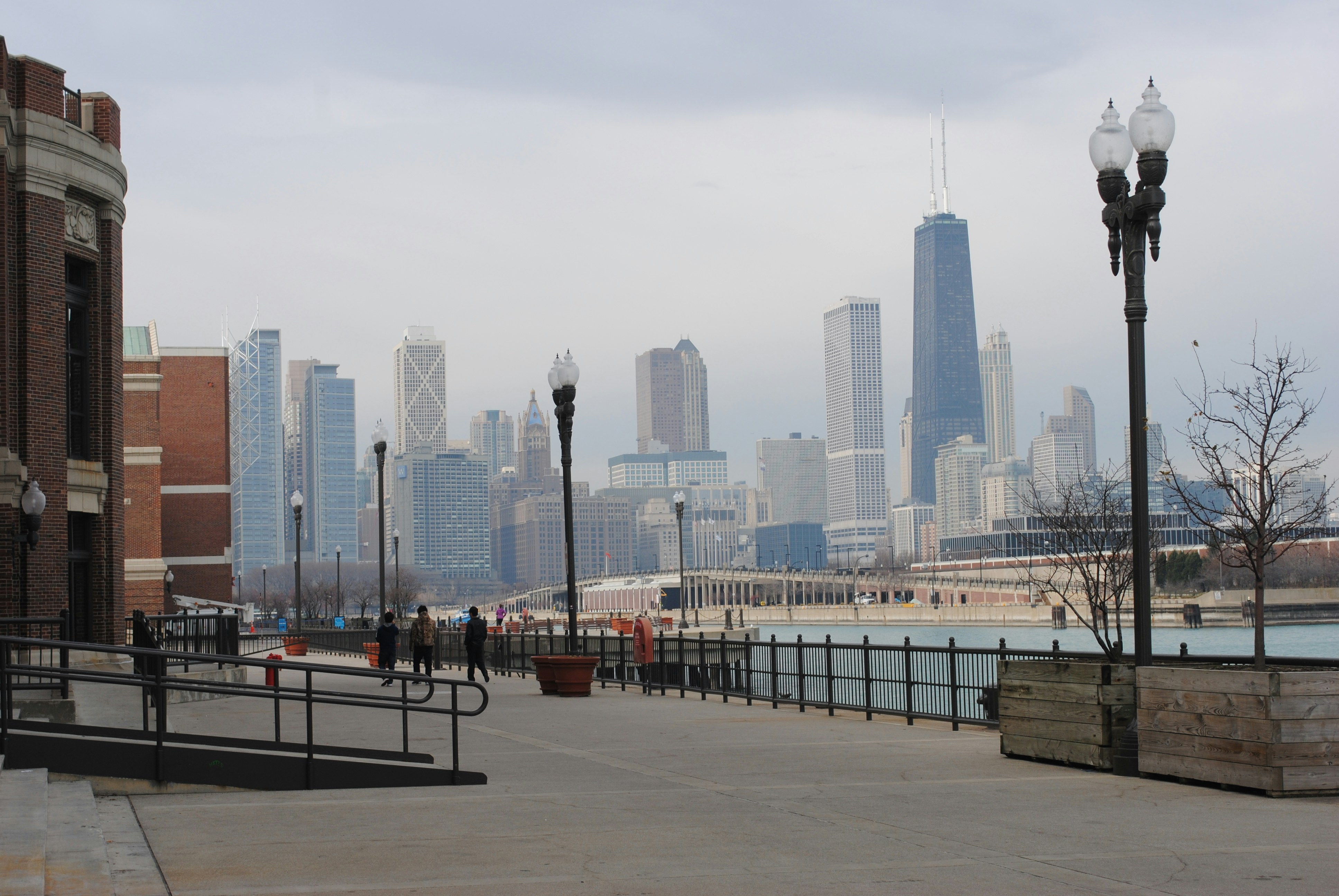 People enjoying the Lakefront Trail with the Chicago skyline in the background - lakeview east 1 bedroom