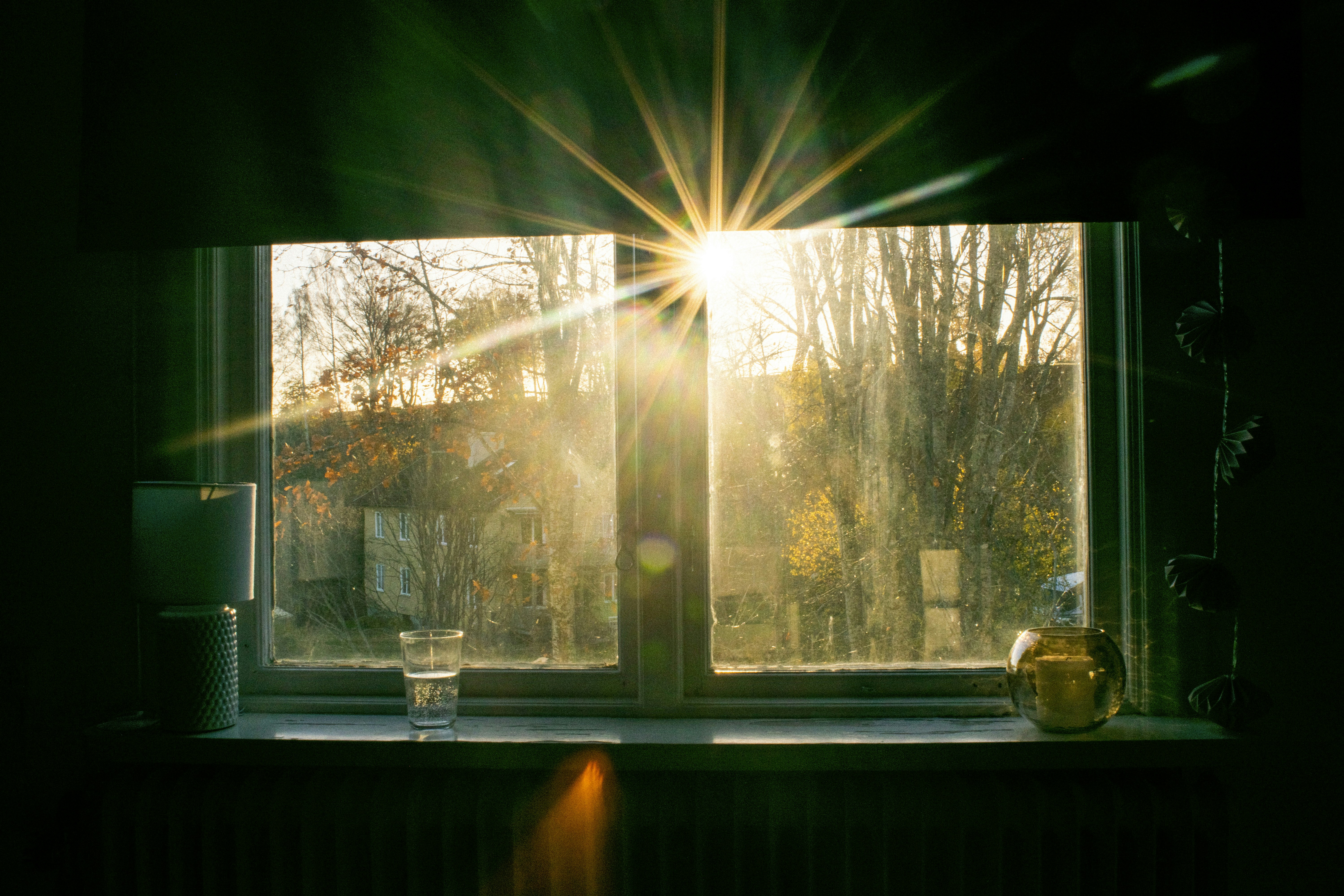 white wooden framed glass window in the morning