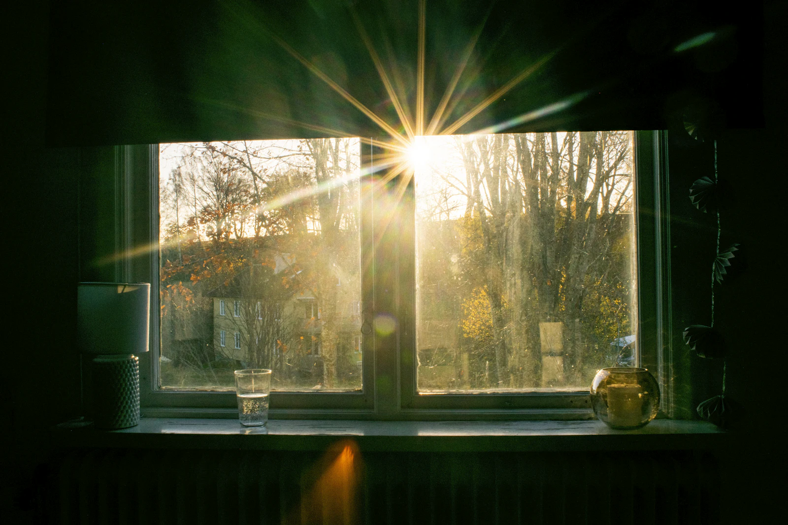 Sunlight streaming through a curtained window