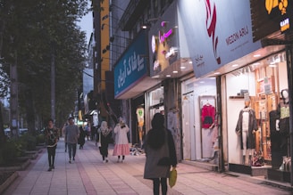 People enjoying a bustling city scene while wearing stylish outfits.