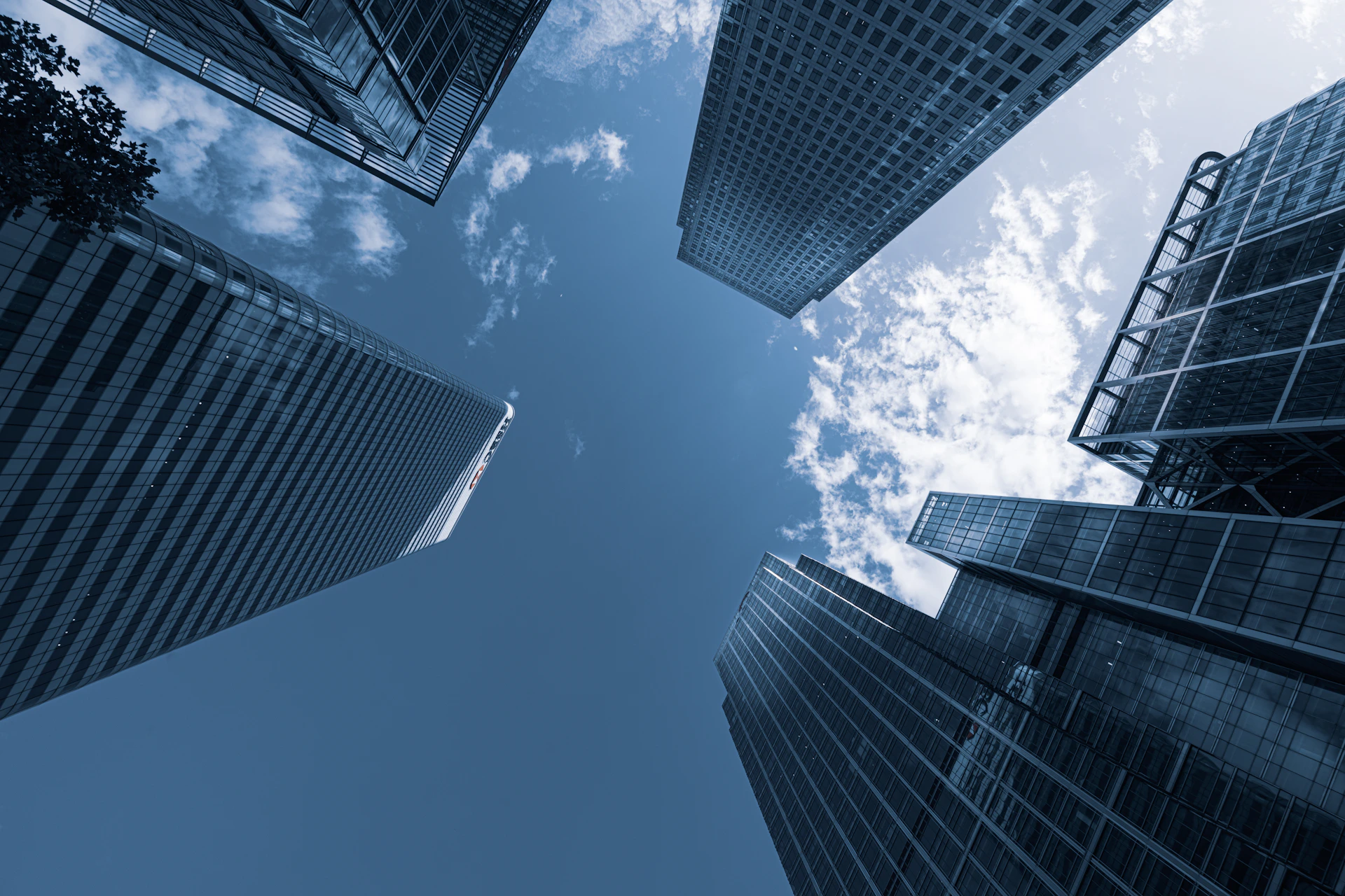 low angle photography of high rise buildings under blue sky during daytime