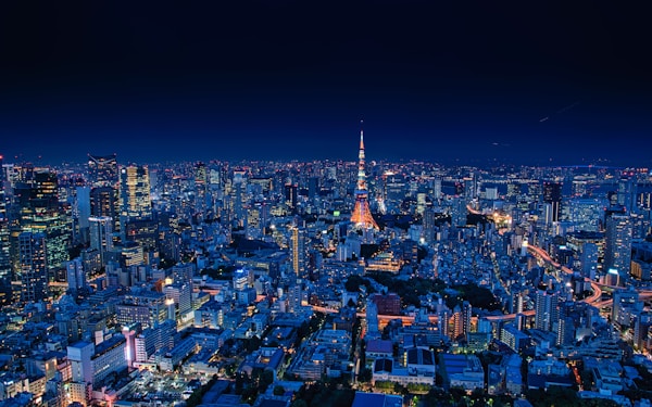 aerial view of city buildings during night timeby Takashi Miyazaki