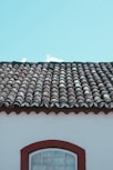 brown roof tiles under white sky during daytime