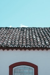 brown roof tiles under white sky during daytime