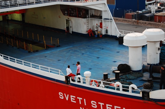 people swimming on pool during daytime