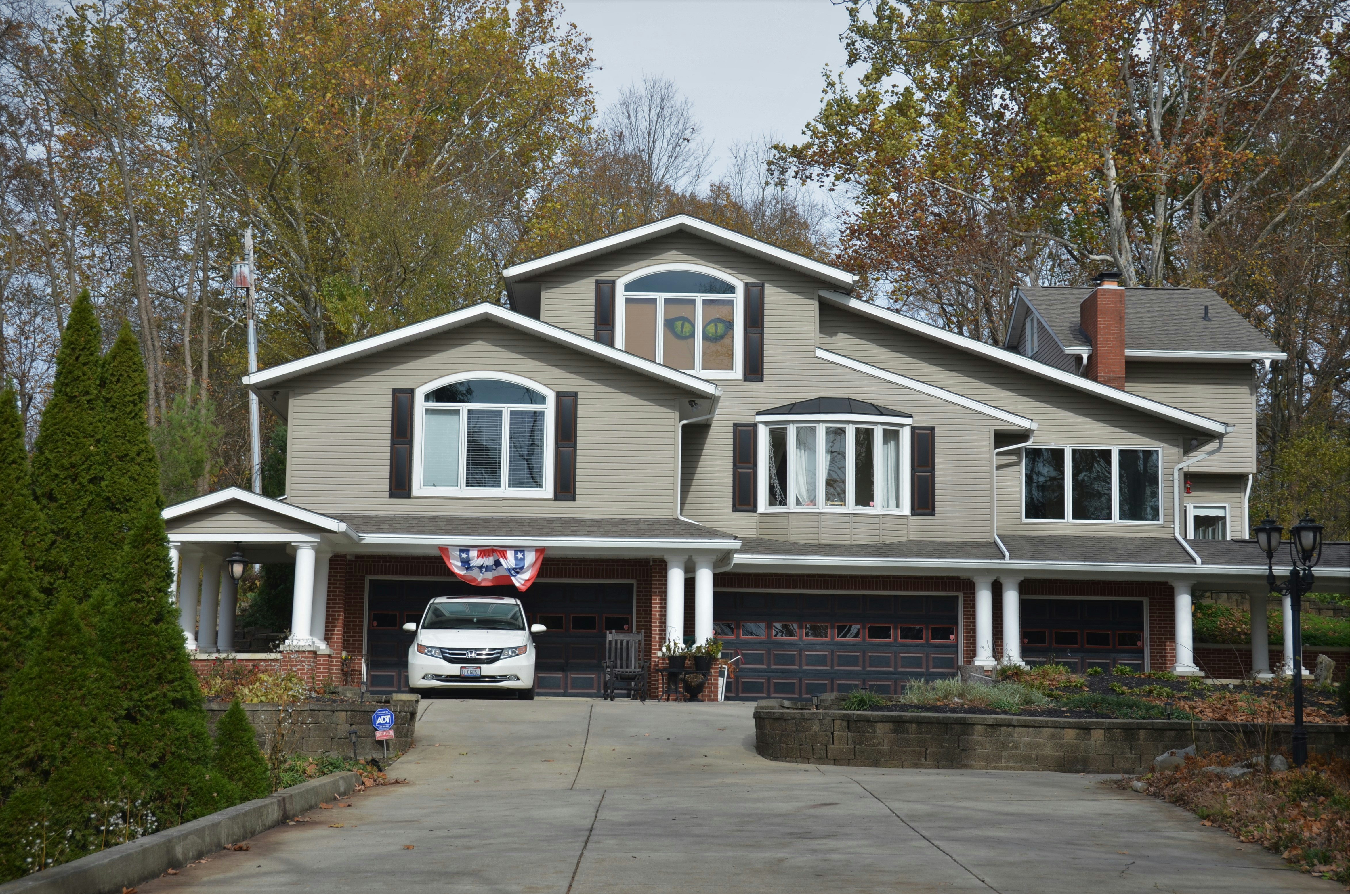 White and gray wooden house near green trees during daytime photo ...