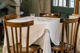 A cozy dining table set for a meal.