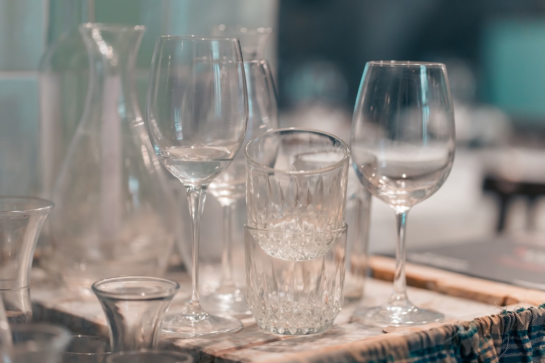clear wine glasses on brown wooden table