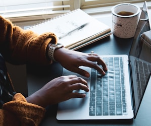 person using black and silver laptop computer