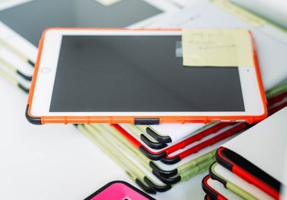 white ipad on white table