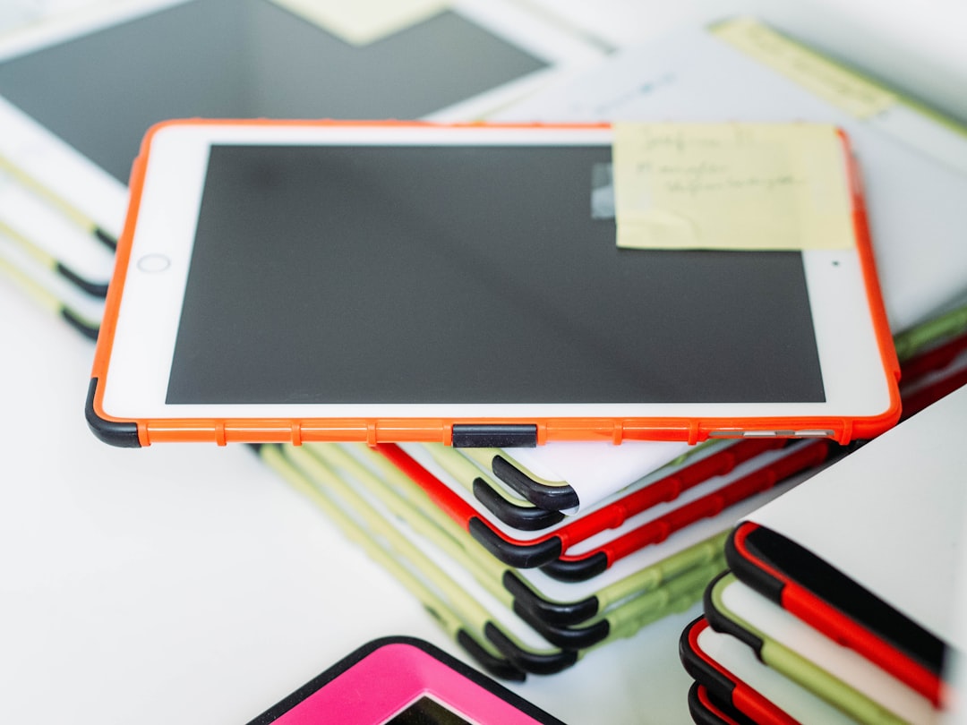 white ipad on white table, iPads used by students in school classrooms.