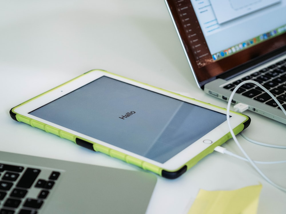 white ipad on white table