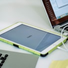 white ipad on white table