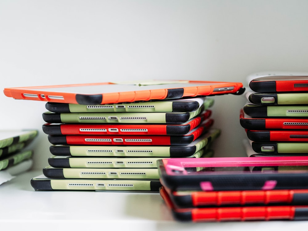 Stacks of refurbished Apple iPads in protective cases