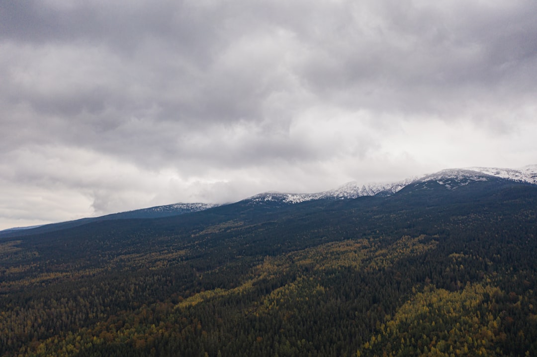 green mountains under white clouds during daytime