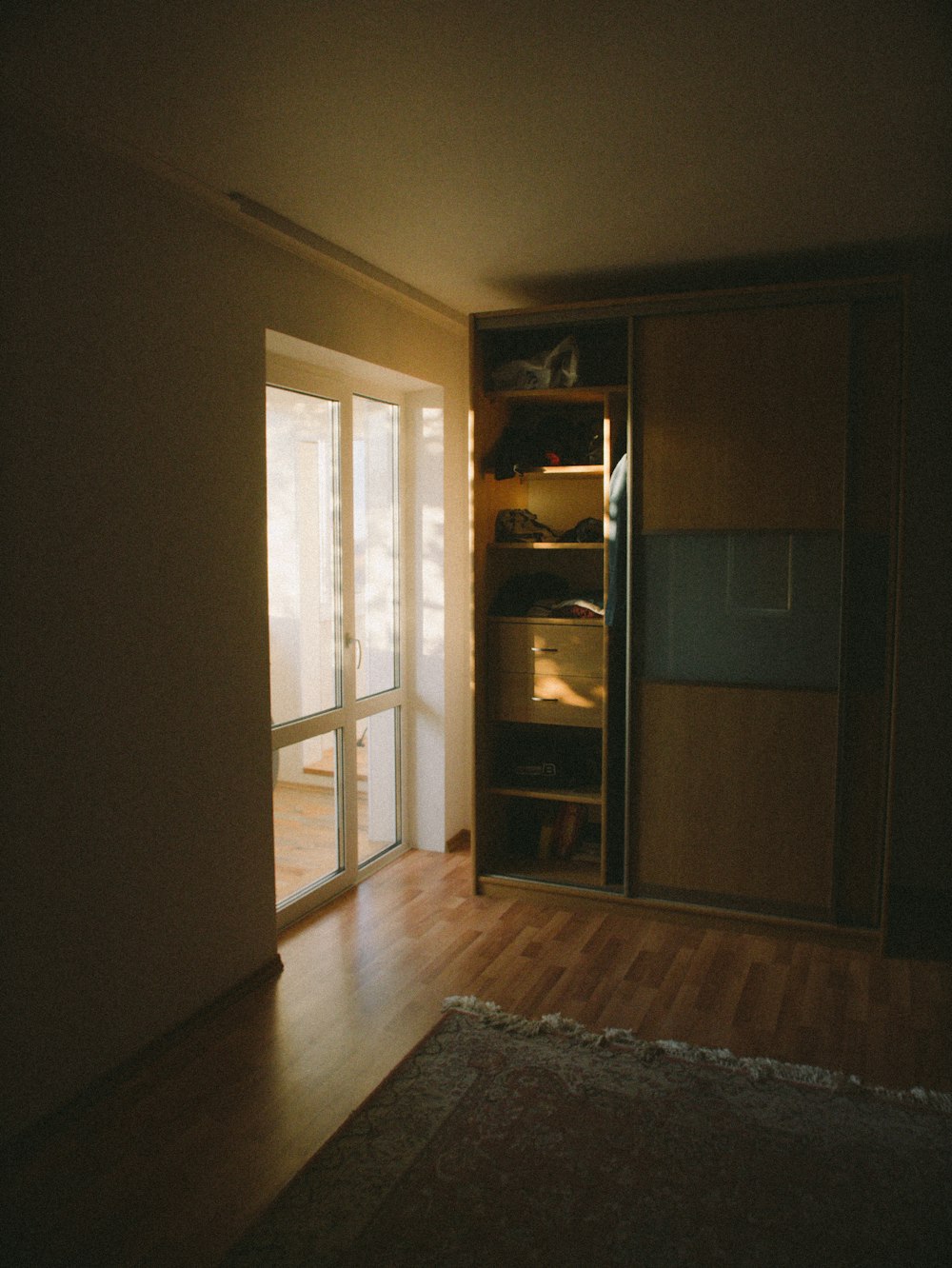 brown wooden cabinet near brown wooden door