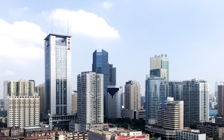 white and gray high rise buildings during daytime