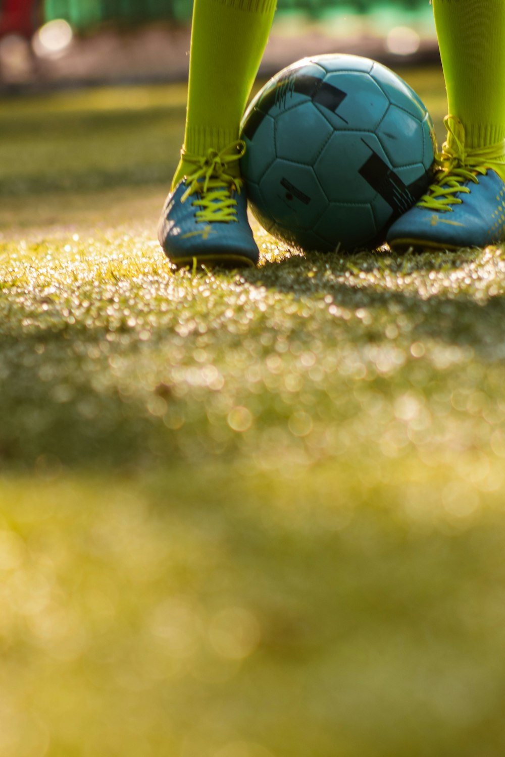 person in blue and green nike soccer jersey