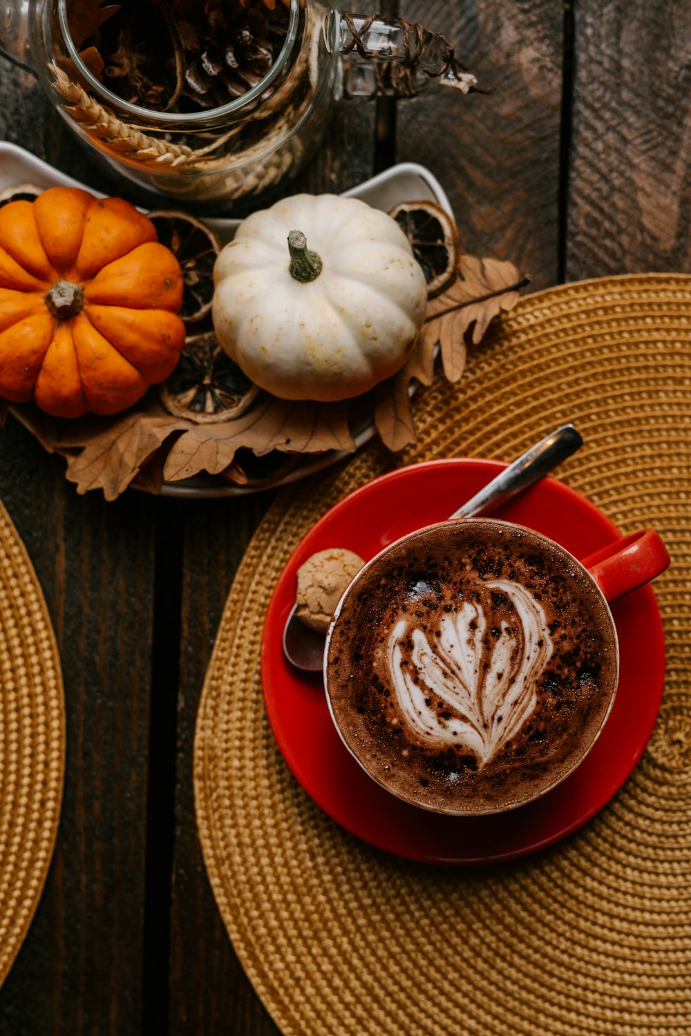 white and orange pumpkin on red ceramic plate