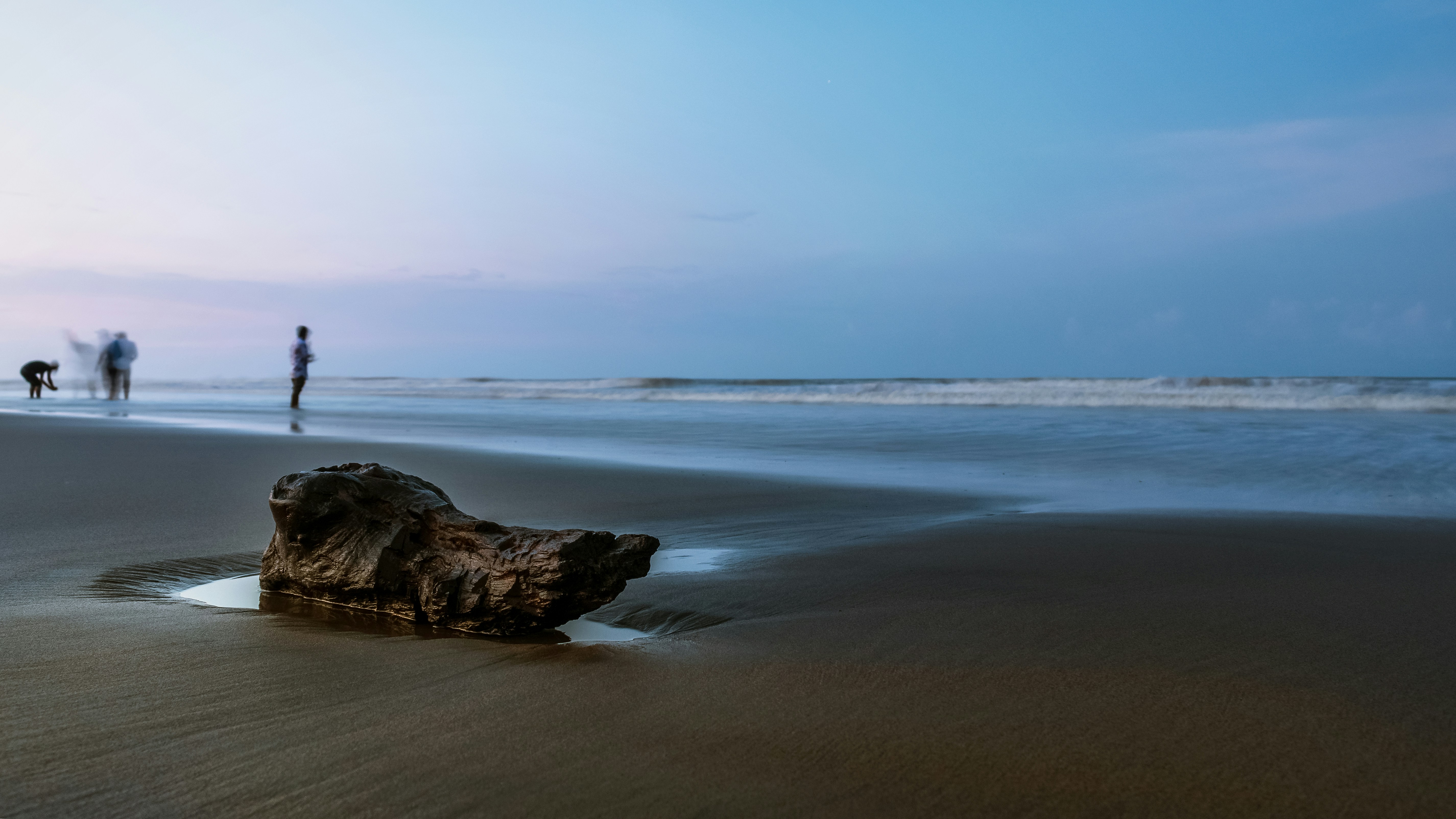 brown rock formation on sea shore during daytime