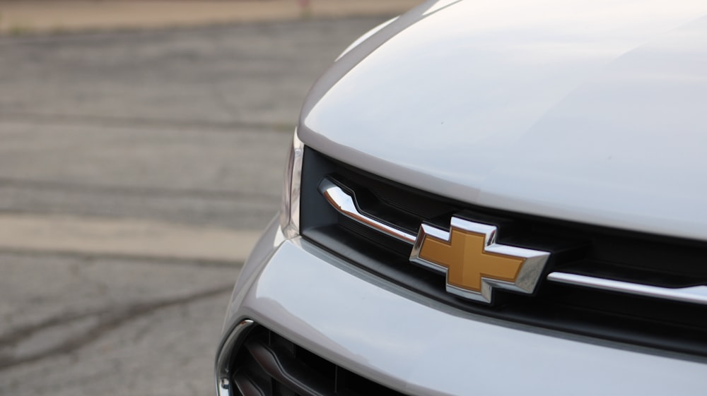 white chevrolet car on road during daytime