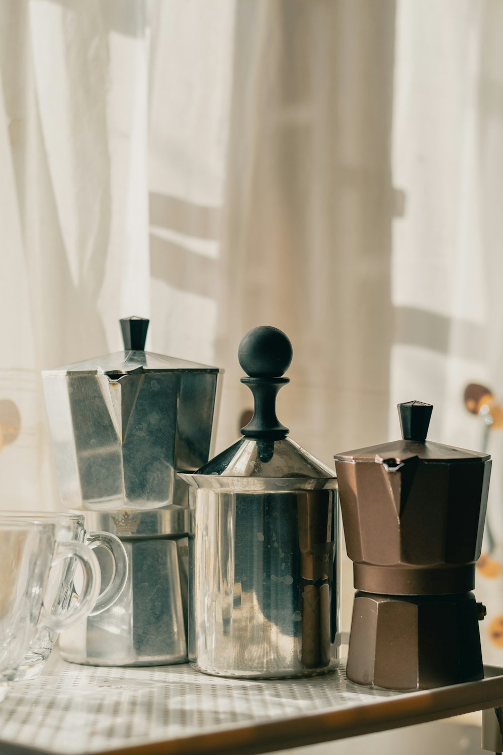 stainless steel pitcher on table